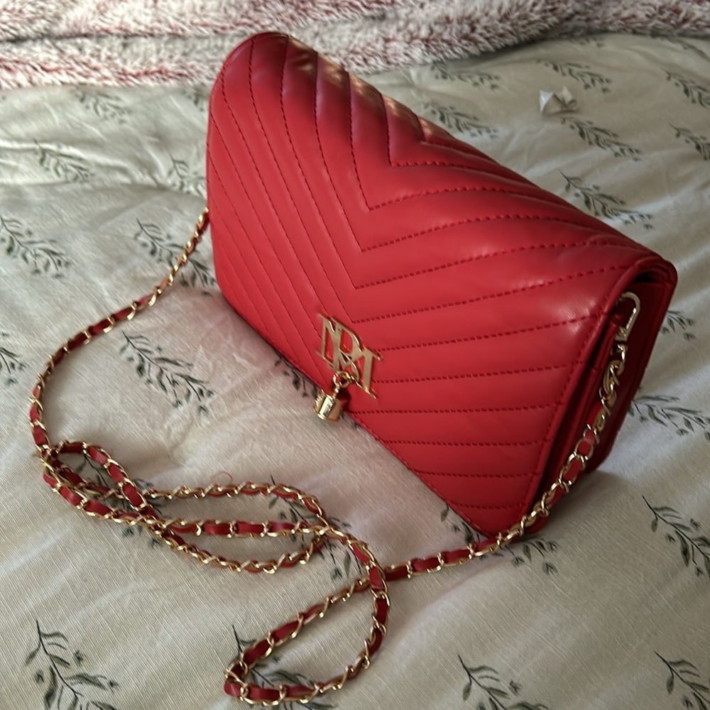 Badgley Mischka red leather shoulder bag with gold chain strap. Never used